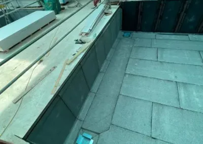 Indoor pool construction site with unfinished walls.